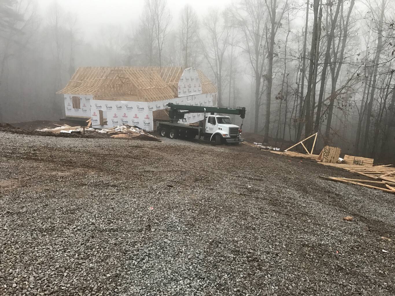 Crane on a foggy morning jobsite
