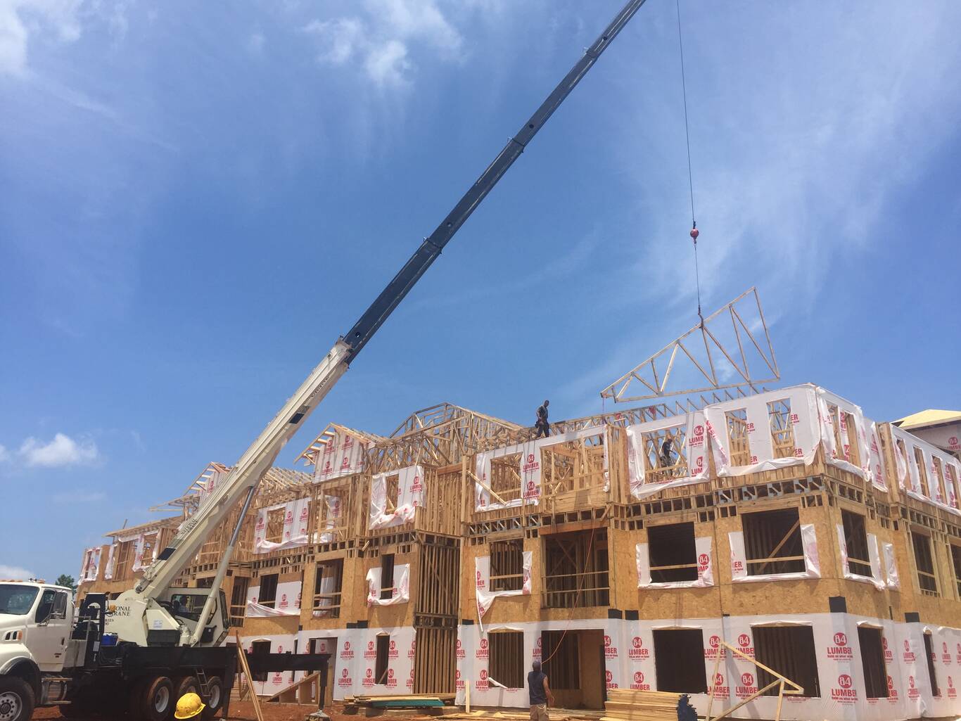 Setting trusses on a three-story build