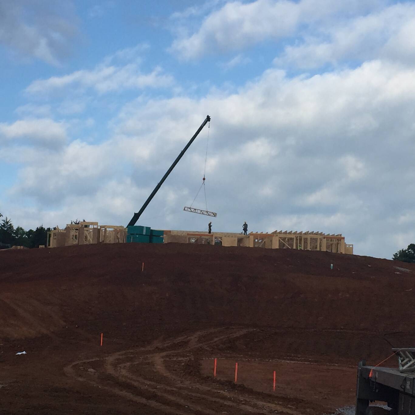 Setting trusses on a hillside build